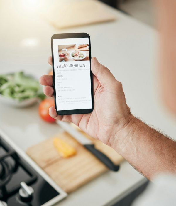 Phone screen, cooking recipe and man with healthy kitchen salad information on website, digital blo